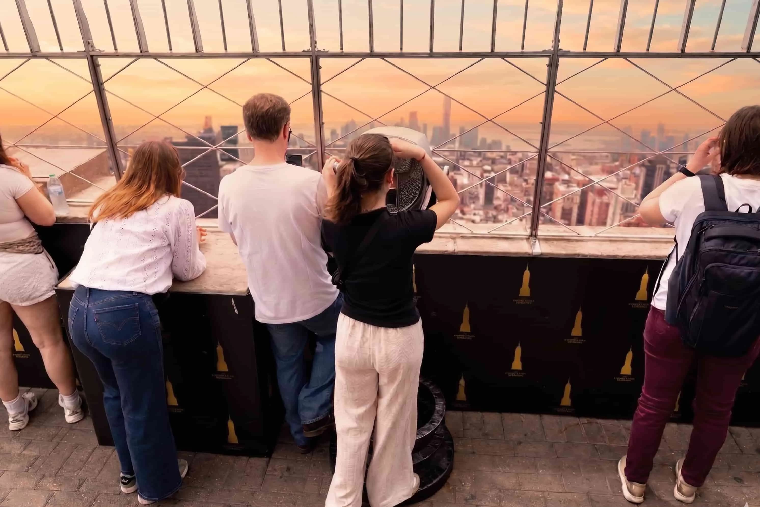 People looking out at the Empire State Building's 86th Floor Observation Deck