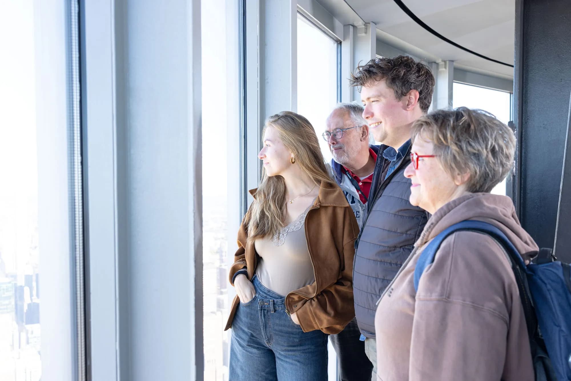 Family looking out to the Manhattan skyline at the 102nd Floor Observation Deck